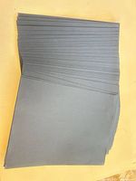 stack of black cardstock sheets fanned slightly to show quantity