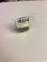 Adapter in sealed plastic viewed from barcode side