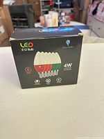 Front of box showing brand, type, wattage and quantity