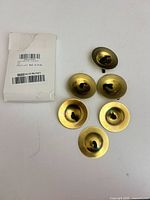 Six brass finger cymbals and packaging front view