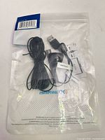 Front of sealed Cable Matters package showing cable, USB plug, IR sensor, and paperwork