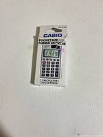 Front view of boxed Casio HS-8VA calculator