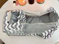 Top view of gray chevron collapsible organizer showing mesh sides and lined interior