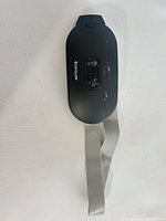Front of CosyGlow massager showing control panel and scratches