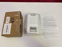 Box, bubble-wrapped charger, manual overview