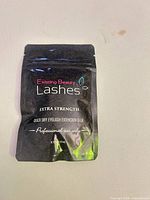 Front of sealed pouch showing branding, size and product details