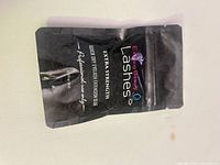Front of sealed pouch showing brand, product name, volume and usage notes