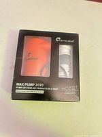 Front of sealed Flextailgear Max Pump 2020 box showing orange pump and white nozzles