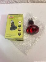 Bulb beside Fuxin Daylightspot box on bubble wrap