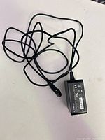 Full view of adapter and cable coiled