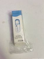 Front of boxed facial mist sprayer showing product image and labeling