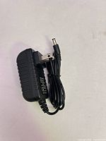 Adapter front with barrel lead coiled