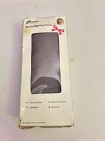 Front of boxed muslin nursing cover showing brand, product name, fabric view window, features