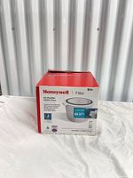 Front angled view of boxed Honeywell J True HEPA filter