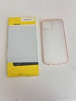 JETech yellow retail box beside clear pink-edged phone case front view