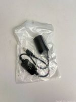Front of sealed package showing adapter cable and connectors