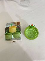 strainer next to box front showing product images