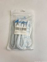 Front of sealed Liwinting package showing two coiled white DC extension cables with barcode label