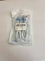 Front of sealed Liwinting cable package showing coiled white cable and barcode label