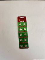 Front of sealed blister card showing ten button cells and LR1130 AG10 labeling