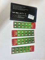 Outer box with four blister strips of LR44 batteries