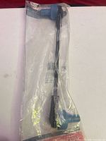 Front view of sealed Motorcraft sway bar link showing full length and blue bushings