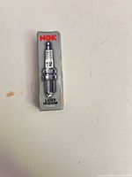 Front of NGK Laser Iridium spark plug box showing branding and spark plug illustration