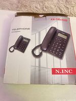 Front view of retail box showing image of telephone and model number
