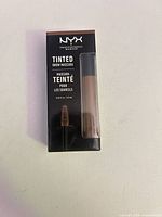 Front of sealed NYX Tinted Brow Mascara box showing tube and branding