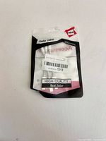 Front of sealed retail pouch showing three white Lightning cables
