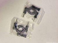 Both sealed bags containing the two handlebar mount clamps