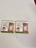 Two retail boxes front view
