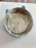 top view of bowl showing stainless insert and cling film
