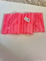 Full view of sealed pack showing multiple pink rollers