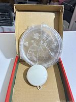 Light with etched Easter design and battery compartment in box