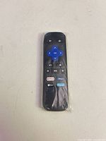 Front view of sealed Roku remote showing buttons and packaging