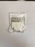 Sealed package containing breaker and DIN rail
