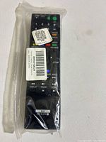 Front view of sealed Sony RMT-B107A remote showing buttons and labels