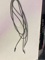 Full view of entire braided cable showing length and both connectors