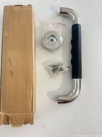 Handle, mounting hardware, screws, and box overview
