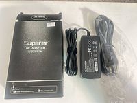 Adapter, power cord and box
