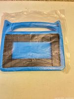 Front view of blue EVA foam tablet case in packaging