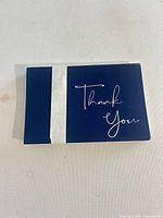 Front view of navy blue thank you card bundle