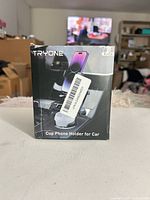 front of retail box showing TRYONE cup phone holder for car