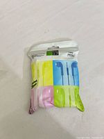 Front of sealed U19 Music 19 earphone package displaying multicolour earbud images