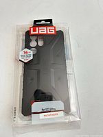 Front of sealed UAG Pathfinder case showing angular black/dark gray design and label for S22 Ultra.
