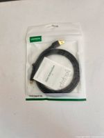 Front view of sealed UGREEN HDMI to Mini HDMI cable package