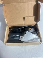Open box showing converter, HDMI cable and instruction sheet