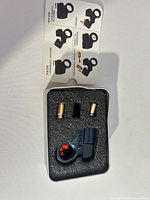 Ring shooter, two pellets, foam case, instructions overview