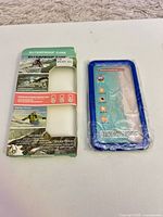 Front of retail box beside sealed case front half
